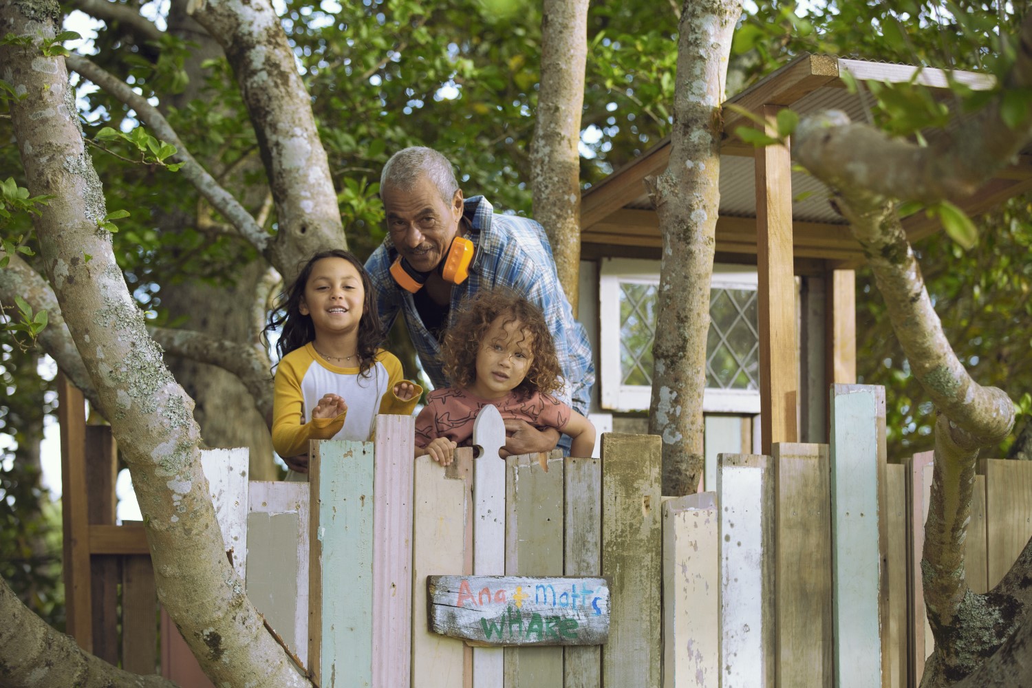 Family standing at a fence