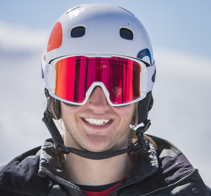 Aaron smiles for the camera in his helmet and goggles