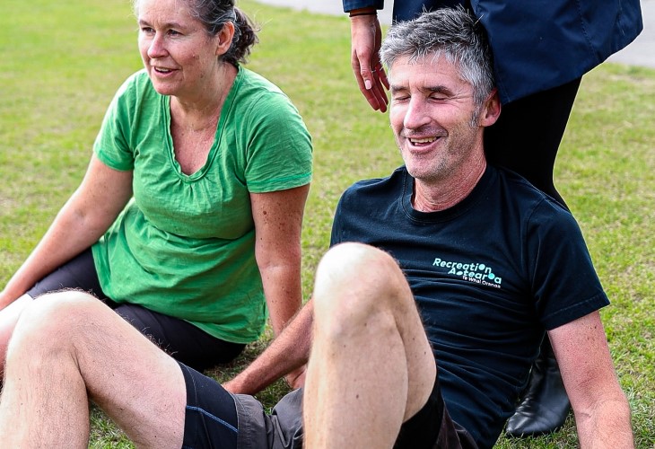 Andrew collapses on the finish line after completing his 5KM run