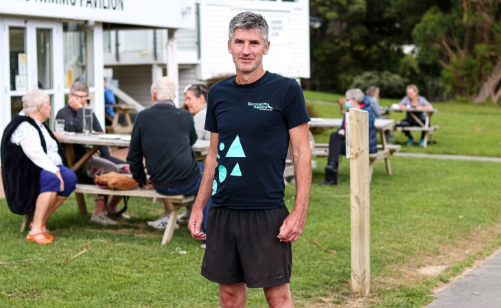 Andrew Leslie poses for a photo after his run