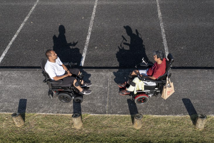 Lee and Wayne have a chat in their wheelchairs