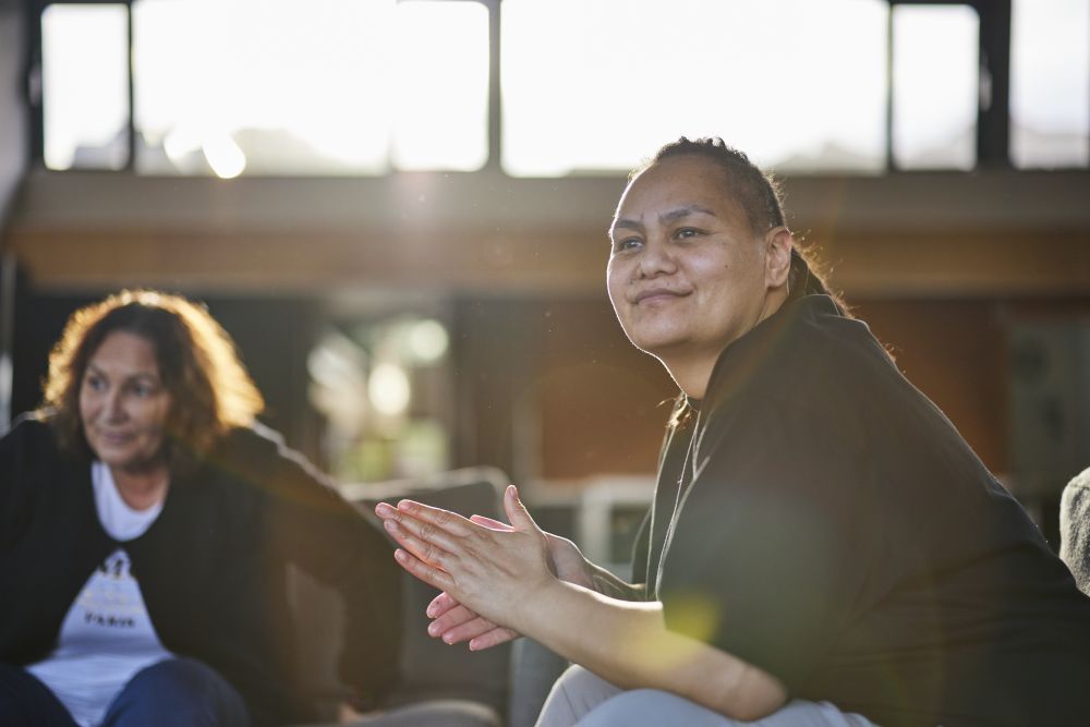 Provider treating young child patient sat with parent or caregiver