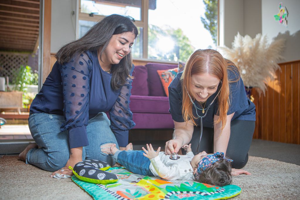 Mother and baby with midwife