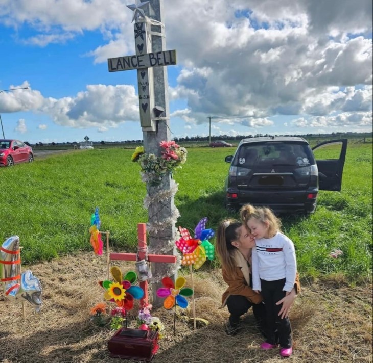 Kavana Jane with her daughter Harley-Jean at the site of the motorbike accident that killed her fiancé.