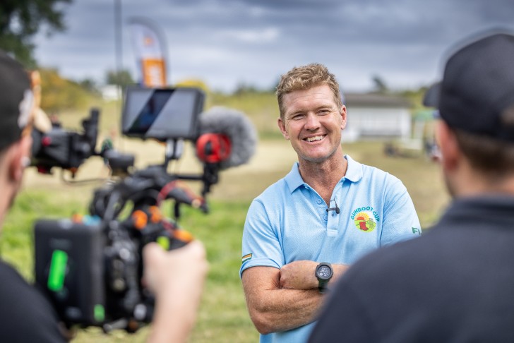 Harry Gaddum being filmed at the Gumboot Cup.