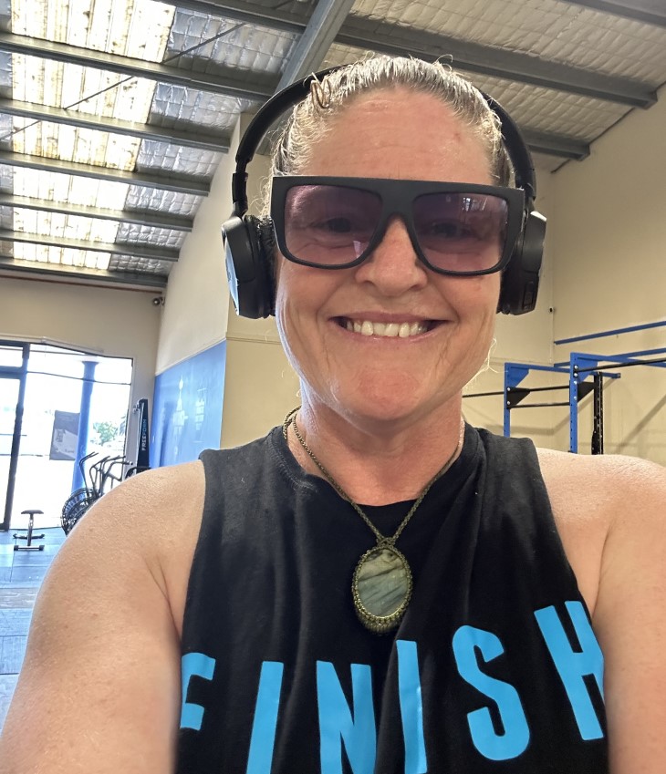 A close-up shot of Jacinta O’Donohue at the gym with a broad smile on her face.