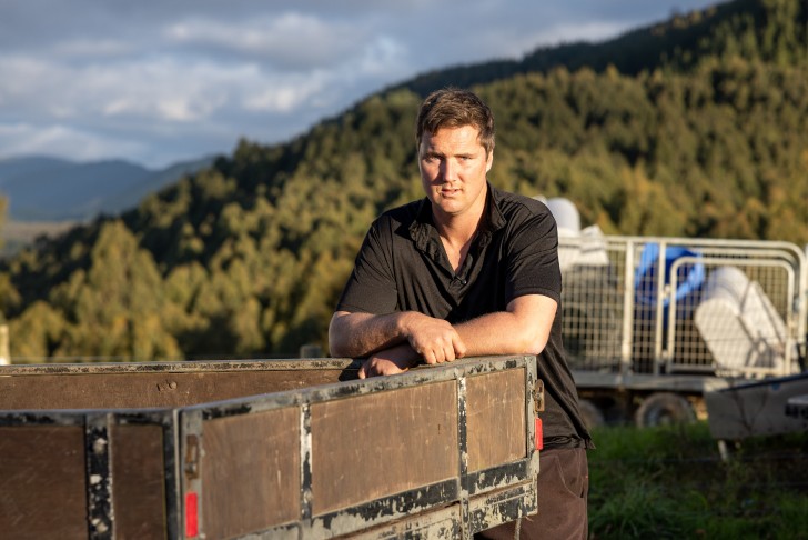 Mark Julian leaning on the back on his truck.