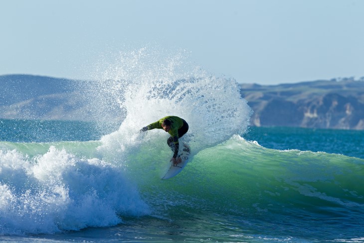 Maz Quinn surfing on a wave. 
