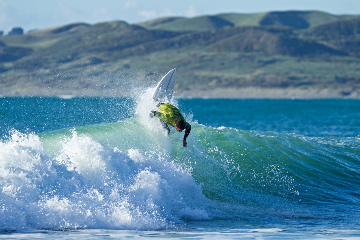 Maz Quinn surfing on a wave. 