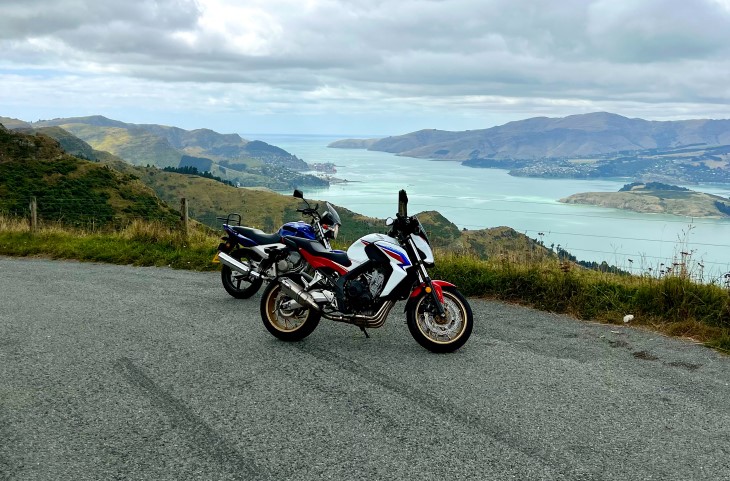 The motorbikes owned by Nick Grant and Sean Dickey before the accident, parked on the side of the road with beautiful scenery in the background.