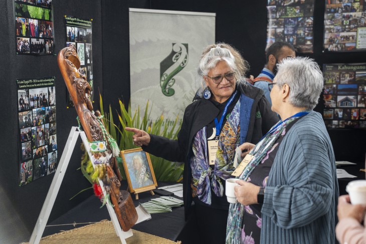 Two Māori women talking to each other at the ACC Rongoā Māori Conference.