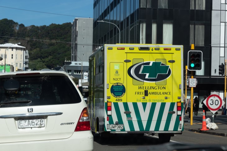 A Wellington ambulance being driven along a road in the city.