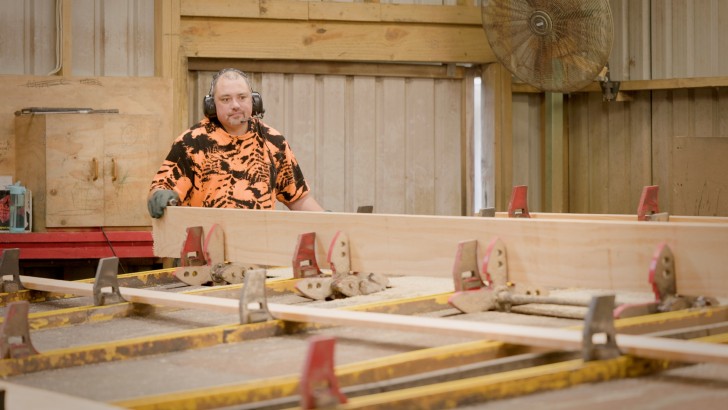 A man working with some timber at Westco Lumber.