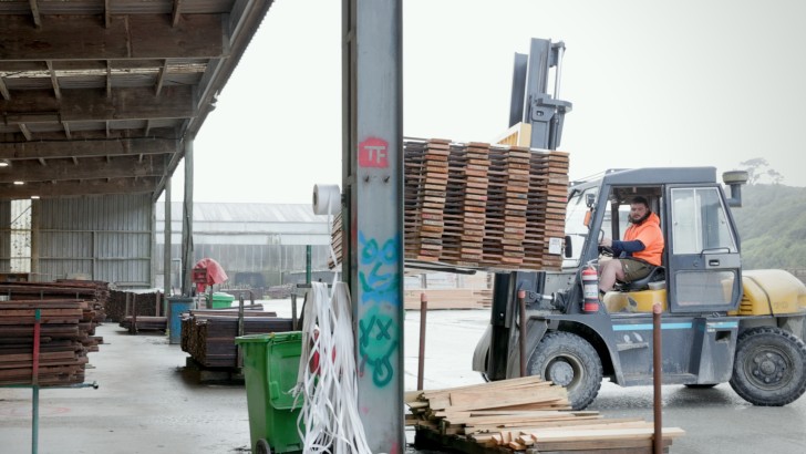 A man driving a forklift at Westco Lumber.